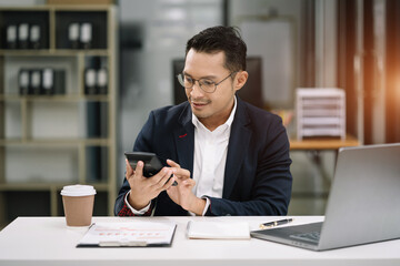 Fototapeta premium Hand businessman doing finances and calculate on desk about cost at office.