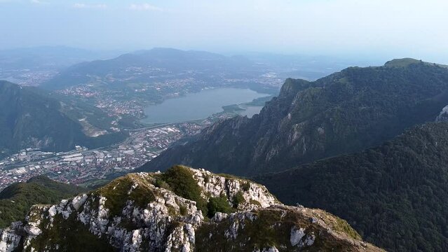 View of Lago di Annone from Corni di Canzo rocky peak