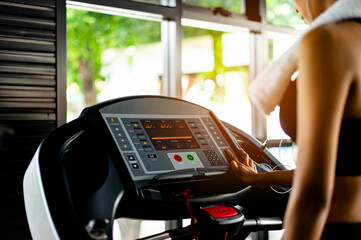 walking exercise on the treadmill with headphones on listen to music while exercising relax from exercise Walking and running for health