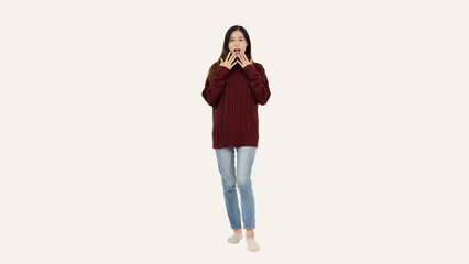 A beautiful young Asian woman in a cozy red sweater poses with a shocked, stunned face