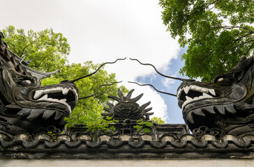 sculptures details of the house roof in Yu garden in Shanghai, China