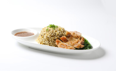 wok garlic olive fried egg rice with grilled chicken chop cutlet in brown sauce and vegetables in plate on vintage table cloth white background asian chef cuisine halal food menu for cafe