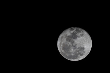 Close up on full moon with dark sky