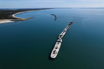 An aerial shot of abandoned concrete ships from World War II