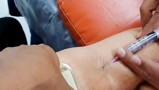 man giving blood sample for different profile blood test at laboratory