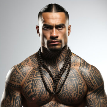 Studio shot of a Maori man showcasing traditional tattoos.
