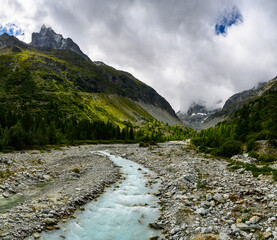 river bed of Navisence in Val d'Anniviers with peak of Le Besso, Valais