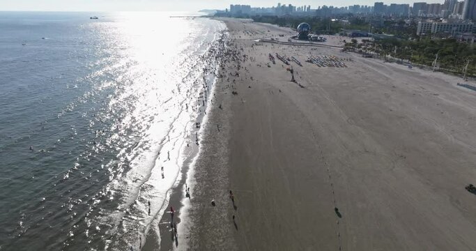Aerial view of people playing on the Beihai Silver Beach at guangxi China for vacation