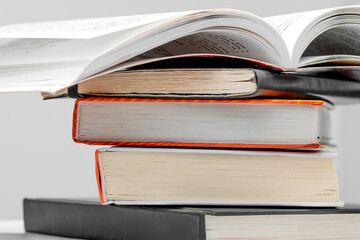 Open book on a stack of books close up. School concept.