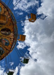 Fototapeta na wymiar Looking up at a swing ride