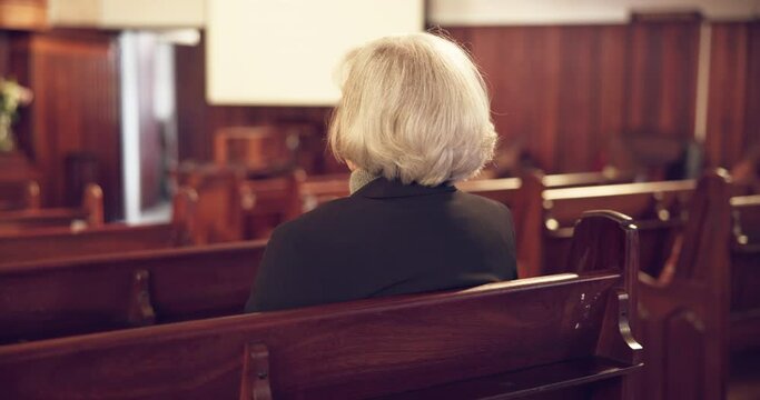 Religion, church and senior woman on a bench for a spiritual congregation service on a Sunday. Faith, peace and back of christian elderly female person in retirement sitting for a sermon in cathedral