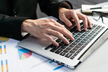 Businessman working with computer in office. Man work on laptop at home. Work from home, business and technology concept. Closeup