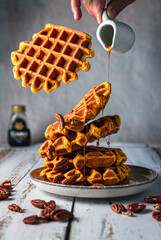 Flying waffles with maple syrup 