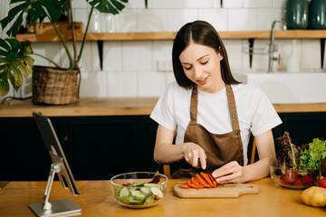 image of asian woman preparing salad in the kitchen and healthy  food in bowl e