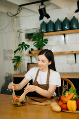 image of asian woman preparing salad in the kitchen and healthy  food in bowl e