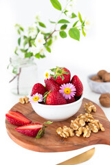 Healthy Snack with Organic Strawberries and Walnuts. Wholesome Vegetarian and Vegan Alternatives.