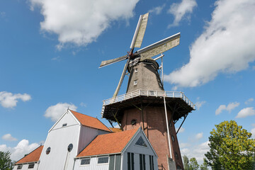Windmill De Zwaluw in Burdaard in Friesland Netherlands in summer. The mill dates from 1875. Flour...