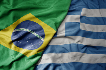 big waving realistic national colorful flag of brazil and national flag of greece .