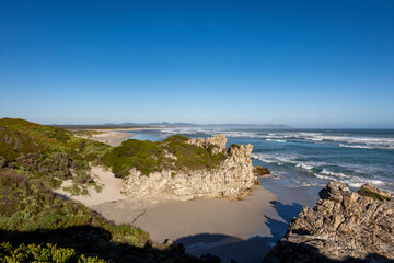 Obraz premium View of Lovers' Cove and in the background, Grotto Beach and Klein Rivier Estuary in the distance. Hermanus, Whale Coast, Overberg, Western Cape, South Africa.