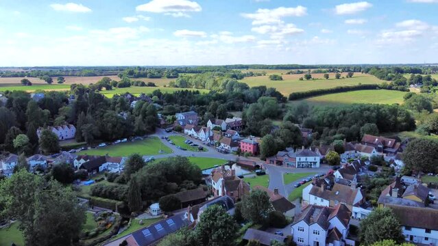 Ascending and tilting down Aerial view of Finchingfield Village.

Known as the most photographed village in Essex, Finchingfield is home to one of the county's few remaining windmills.