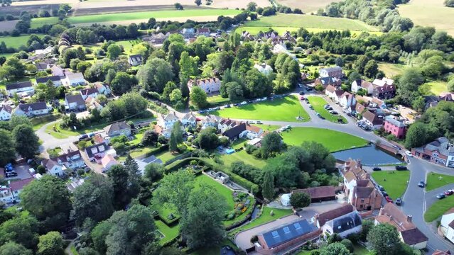 Aerial view of Finchingfield Village panning right and reversing.

Known as the most photographed village in Essex, Finchingfield is home to one of the county's few remaining windmills.