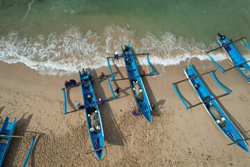 fishing boats anchored on the shore. Indonesia is the largest maritime country in the world that...