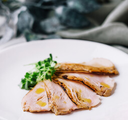 Sliced duck breast roasted meat on a plate