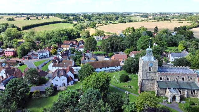 Aerial view of flying away from Finchingfield Church.

Known as the most photographed village in Essex, Finchingfield is a quaint tourist destination.