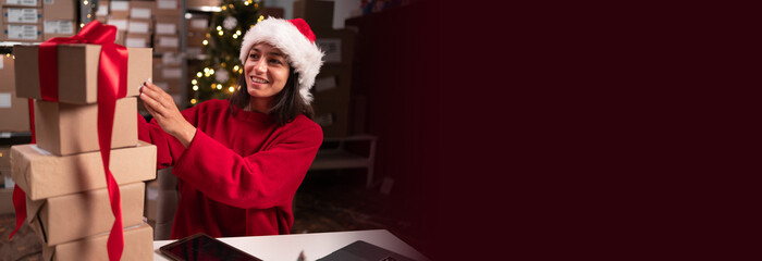 Female inventory manager working with cardboard packages. Customer Orders. Stock of parcels with...
