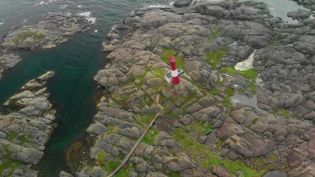 drone flies over lighthouse on norwegian south coast Eigeroy Fyr