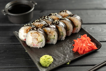 Sushi Roll with salmon, fried tuna, avocado and cheese. Sushi menu. Japanese food concept.