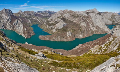 Turquoise waters reservoir and mountain panoramic landscape in Riano. Spain
