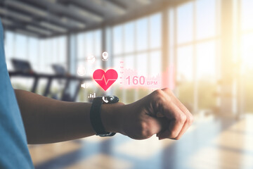 Man excercise and using smartwatch to monitoring and tracking health and heart rate by applications. technology and healthy concept.