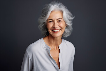 AI generated image of mature senior woman on grey background in studio
