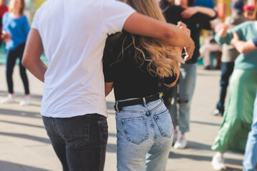 Couples dancing traditional latin argentinian dance milonga outdoor in the city streets, tango...