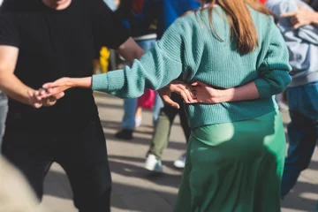 Foto op Plexiglas Dansschool Couples dancing traditional latin argentinian dance milonga outdoor in the city streets, tango salsa bachata kizomba lesson, outdoors dance school class festival in a summer sunny day