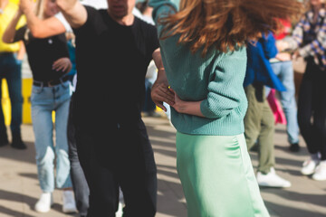 Couples dancing traditional latin argentinian dance milonga outdoor in the city streets, tango...