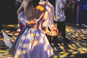 Abwaschbare Fototapete Tanzschule High school graduates dancing waltz and classical ball dance in dresses and suits on school prom graduation, classical ballroom dancers dancing, waltz, couples quadrille and polonaise