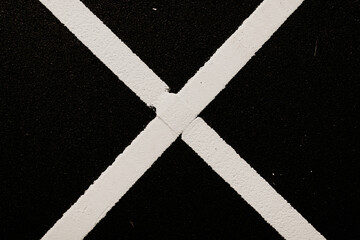 Fototapeta na wymiar Dark asphalt road background with white marking lines. Close up photo. 