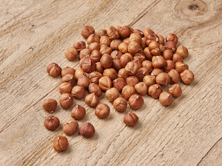 Delicious nuts and dry fruits on the background, close up style, in the plate still life.