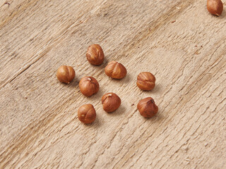 Delicious nuts and dry fruits on the background, close up style, in the plate still life.