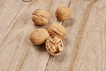 Delicious nuts and dry fruits on the background, close up style, in the plate still life.