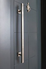 Exterior door doorknob, close up, chromium material style.