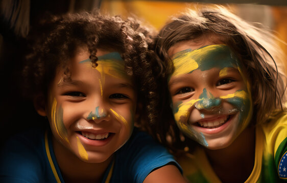 young children with their faces painted in the colors of the Brazil flag