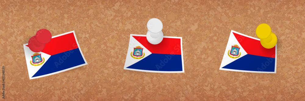 Wall mural Sint Maarten flag pinned in cork board, three versions of Sint Maarten flag.