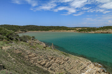 The blue Adriatic Sea, the stony shore of the island of Rab