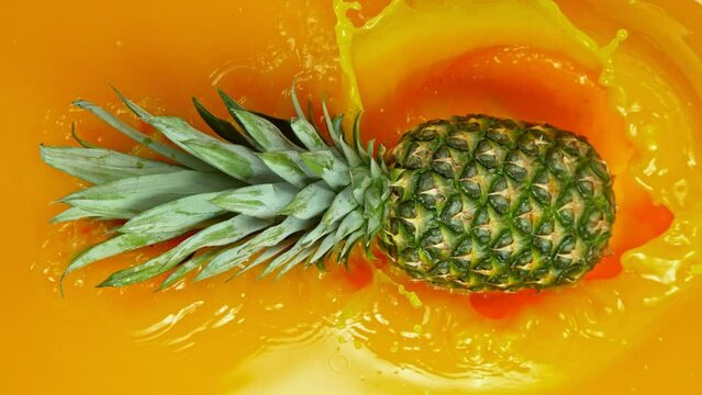 Super Slow Motion Shot of Splashing Fresh Pineapple. Filmed on High Speed Cinematic Camera at 1000fps.
