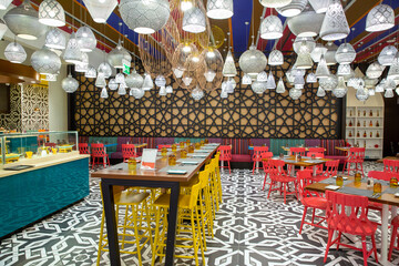 Bright interior with many different lamps of original design in Arabic style