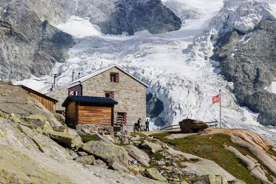 Cabane du Mountet in front of Glacier with Swiss Flag