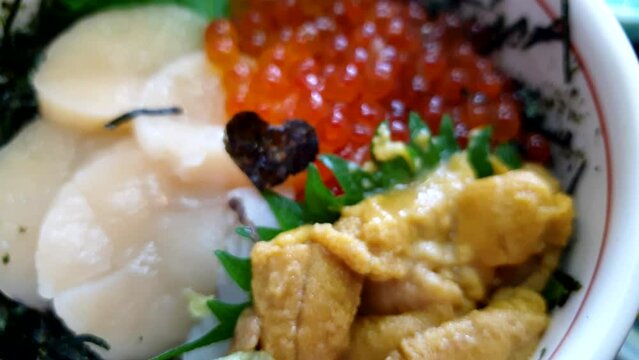 Japanese seafood don ikura hotate uni over rice Hokkaido fresh food